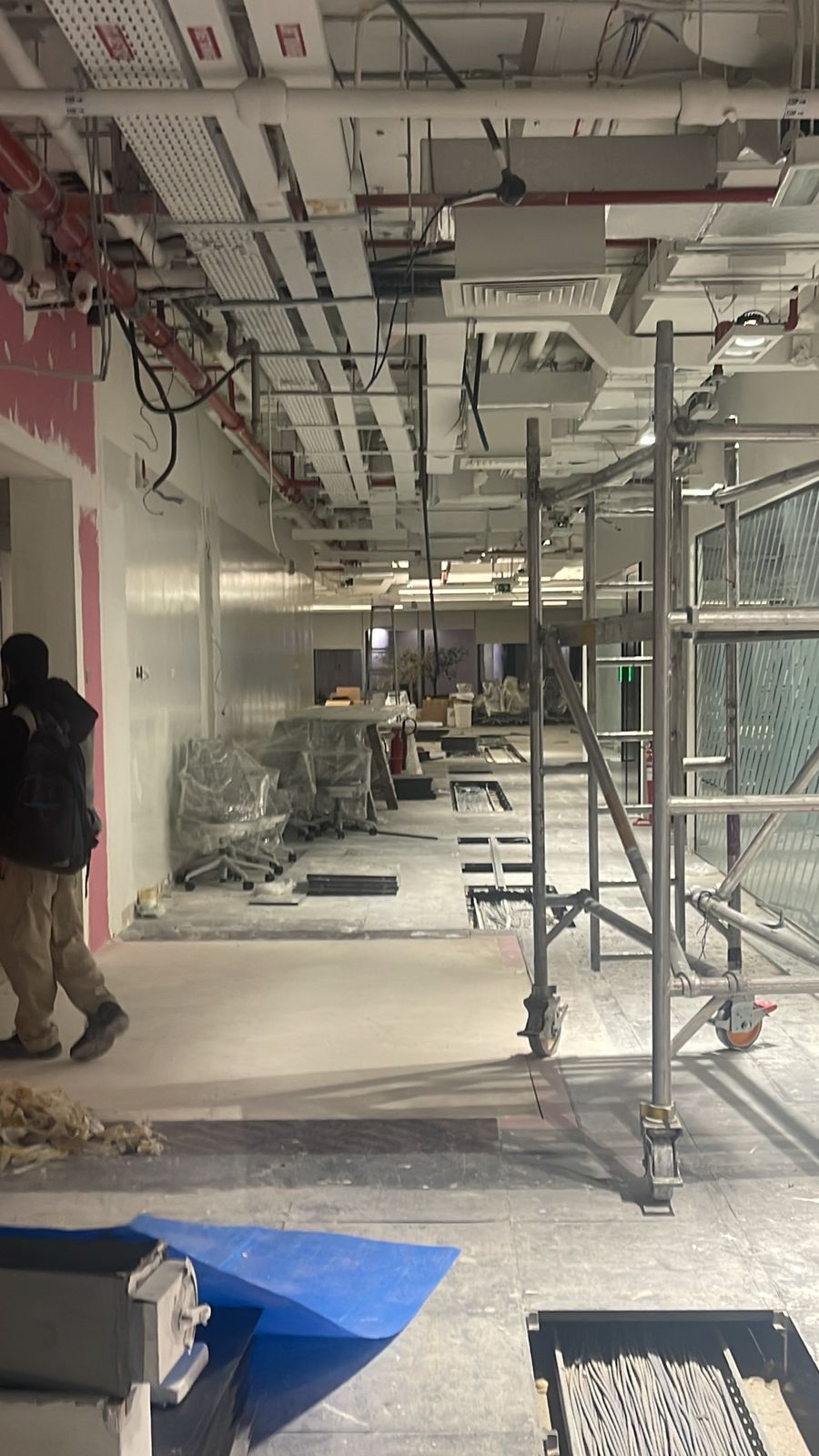 Trefina Interiors site team carrying out MEP and ceiling works on an active fit-out
